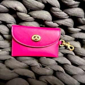Leather Coach card case in Barbie pink, with clip